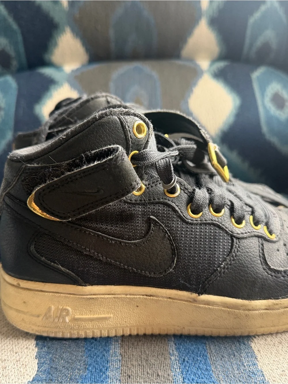 Nike Kids Black Sneakers with Gold Eyelets